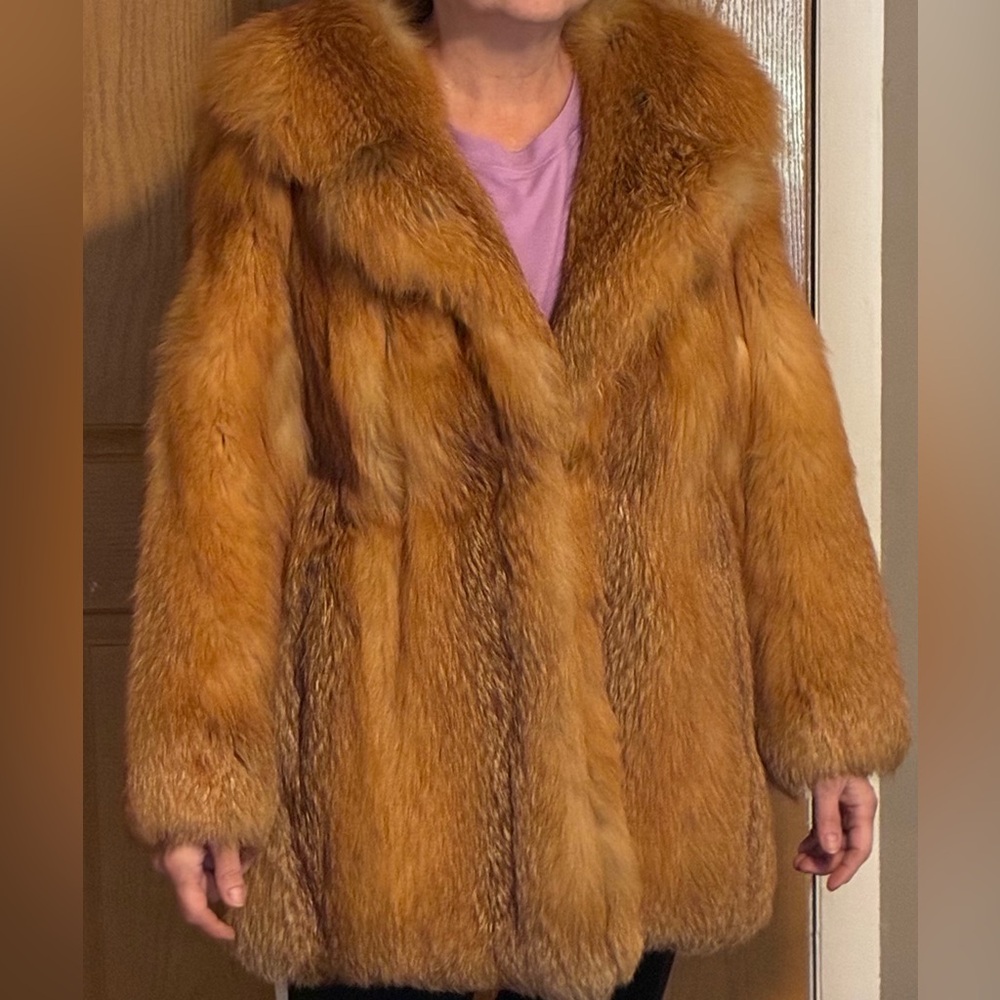 Luxurious genuine, red fox fur coat